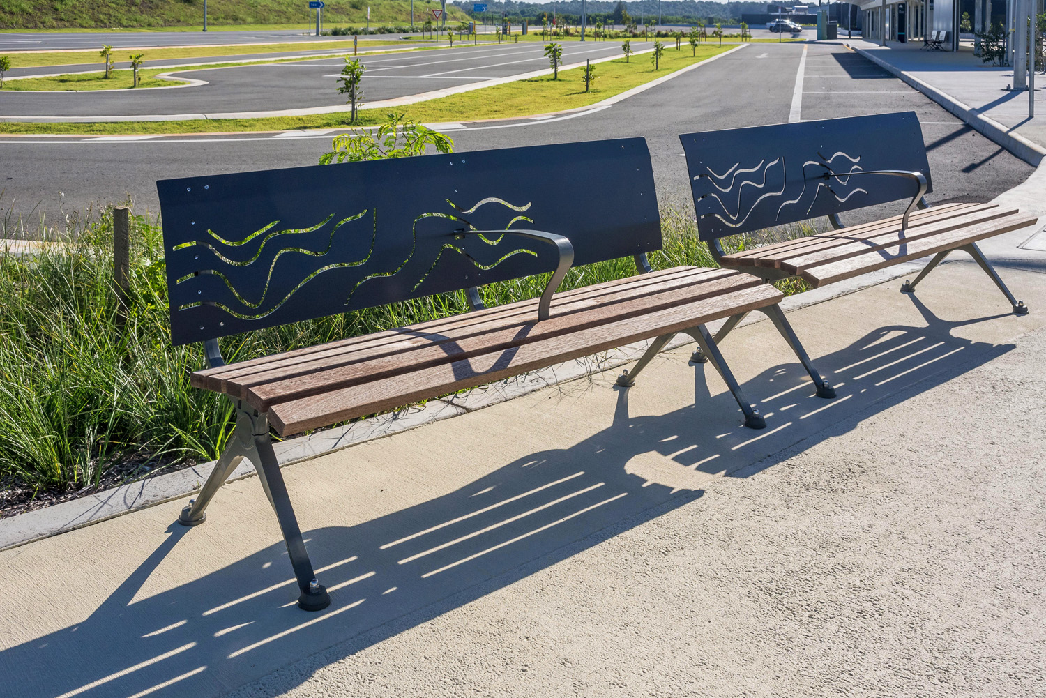 Mall DDA Seats (CMM7) with custom backrests in Monument, Jarrah battens and Woodland Grey frames.
