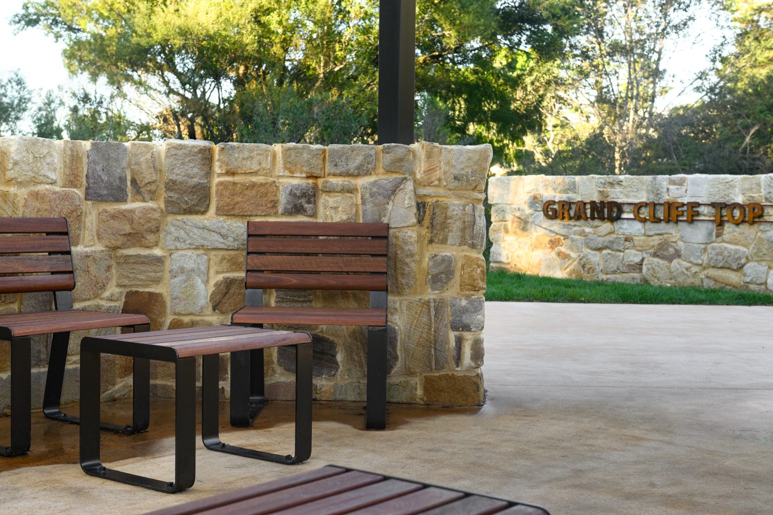Linea Bench (LIB6) and Linea Seat (LIS10) with Spotted Gum hardwood battens, Textura Dark Bronze frame.