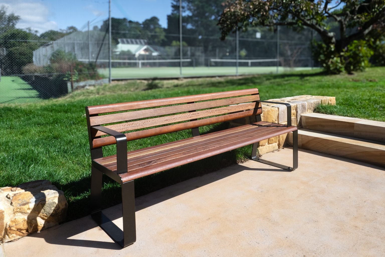Linea Seat (LIS10) with Spotted Gum hardwood battens, Textura Dark Bronze frame.