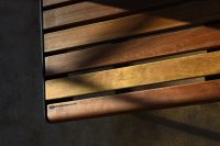 Linea Seat (LIS10) detail with Spotted Gum hardwood battens, Textura Dark Bronze frame.