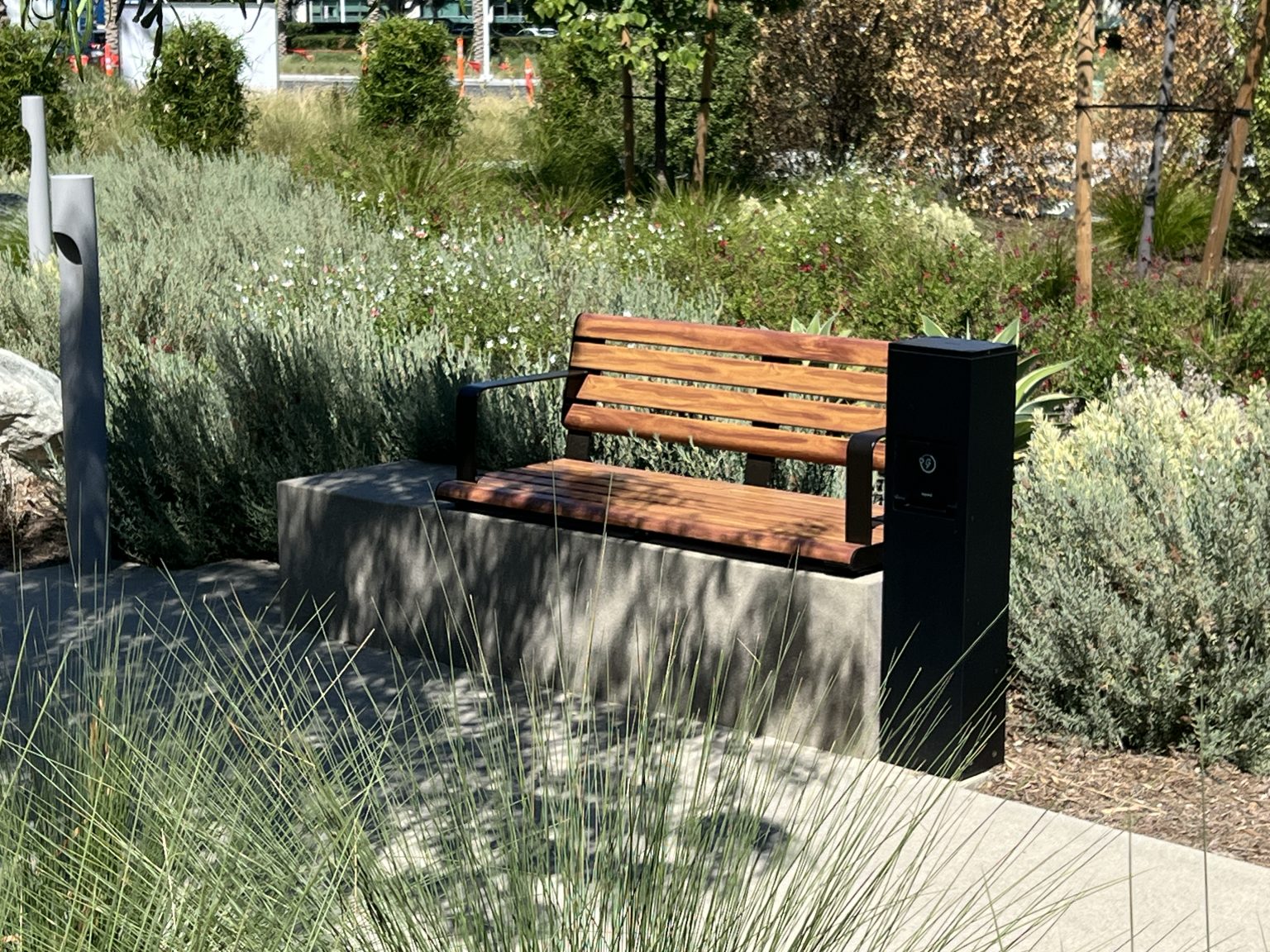 Linea Seat (LIS10) with alum Spotted Gum battens and Textura Dark Bronze frame.