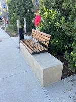 Linea Seat (LIS10) with alum Spotted Gum battens and Textura Dark Bronze frame.