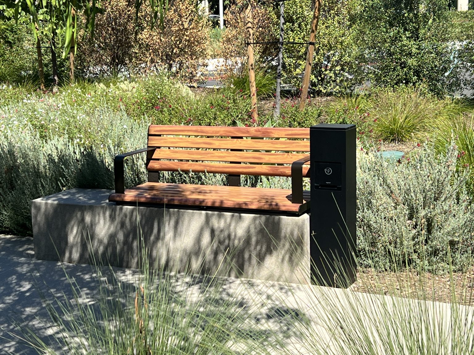 Linea Seat (LIS10) with alum Spotted Gum battens and Textura Dark Bronze frame.