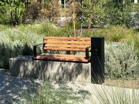 Linea Seat (LIS10) with alum Spotted Gum battens and Textura Dark Bronze frame.