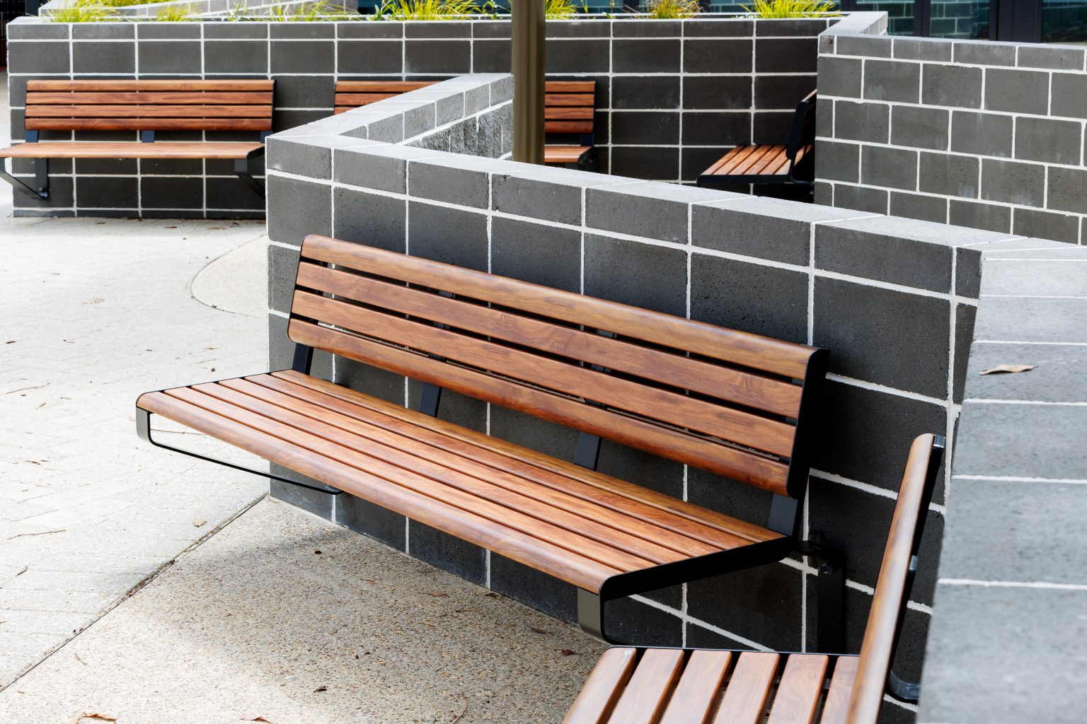Linea wall mounted seats in aluminium spotted gum and charcoal frame