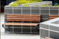 Linea wall mounted seats in aluminium spotted gum and charcoal frame