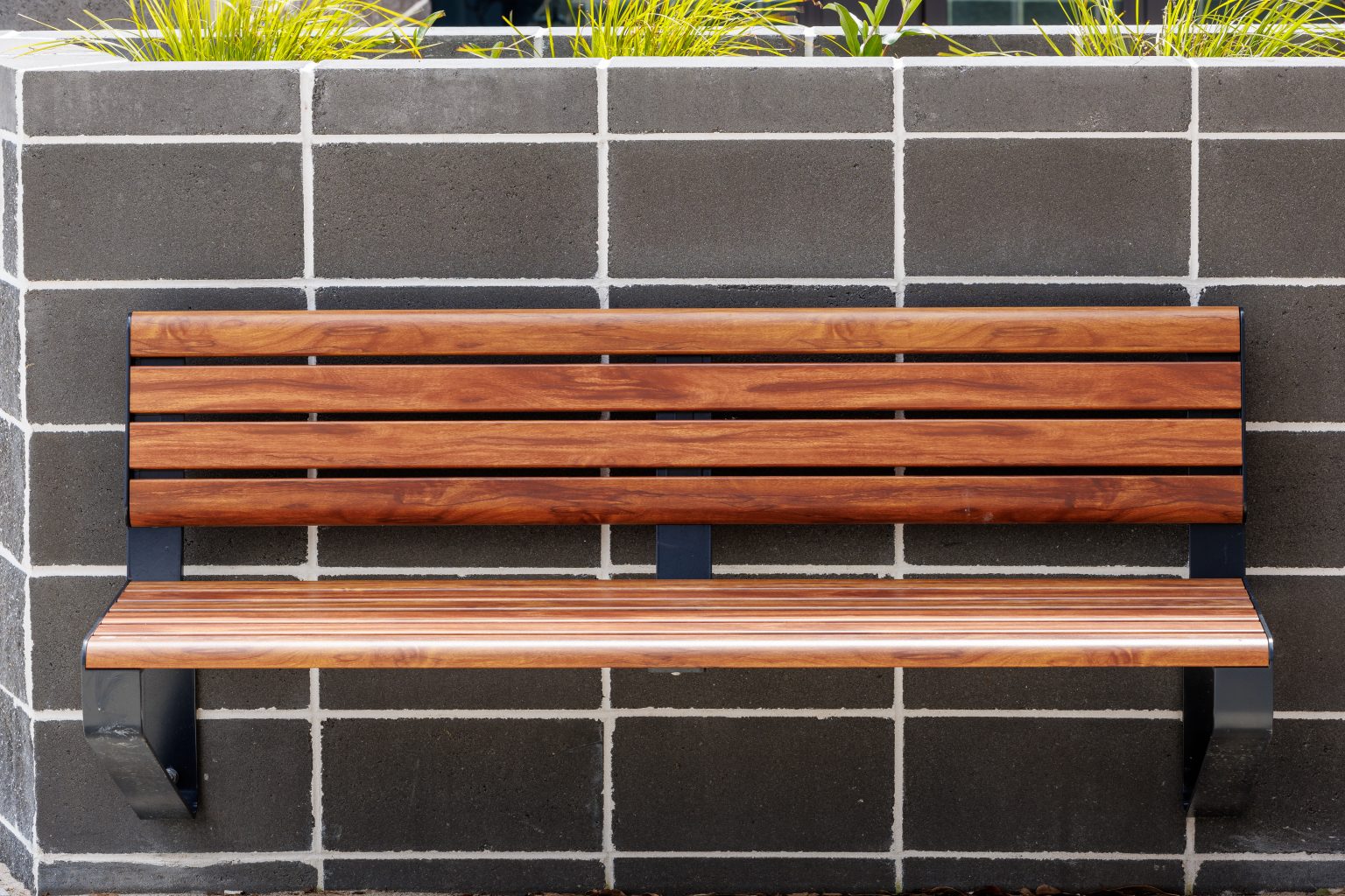 Linea wall mounted seats in aluminium spotted gum and charcoal frame
