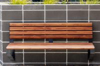 Linea wall mounted seats in aluminium spotted gum and charcoal frame