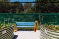 Linea Seat (LIS10 1800mm), freestanding with Bondi Blue frame and Sensation Orange battens