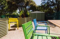 Piatto Chairs with aluminium battens in Viper Green, Brilliant Yellow and Bondi Blue. Linea Table in Viper Green frame with aluminium woodgrain battens in Spotted Gum