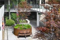 Curved Linea VT Seat - Convex (LVS10-C) surface fixed, with Jarrah hardwood battens, Textura Dark Bronze frame