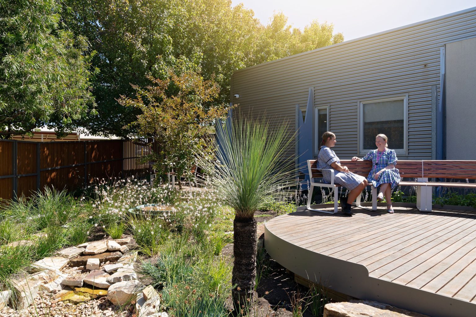 Linea Curved Seats in Textura Surfmist, Wood Without Worry battens in Spotted Gum.