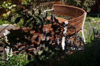 Linea Curved Seats in Textura Surfmist, Wood Without Worry battens in Spotted Gum.