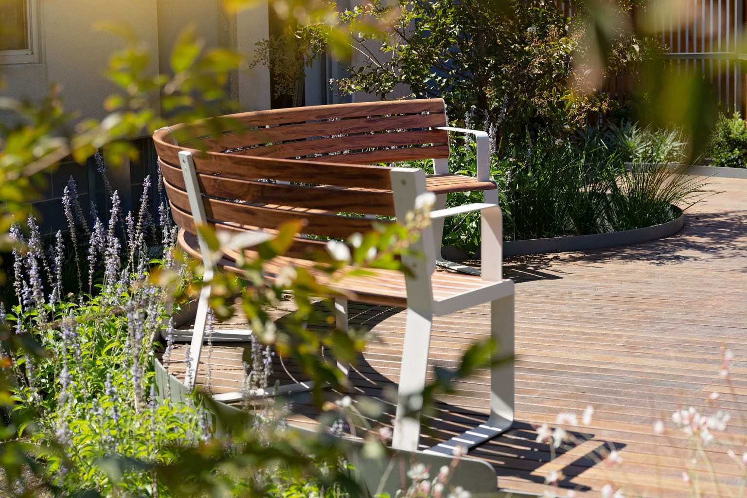 Linea Curved Seats in Textura Surfmist, Wood Without Worry battens in Spotted Gum.