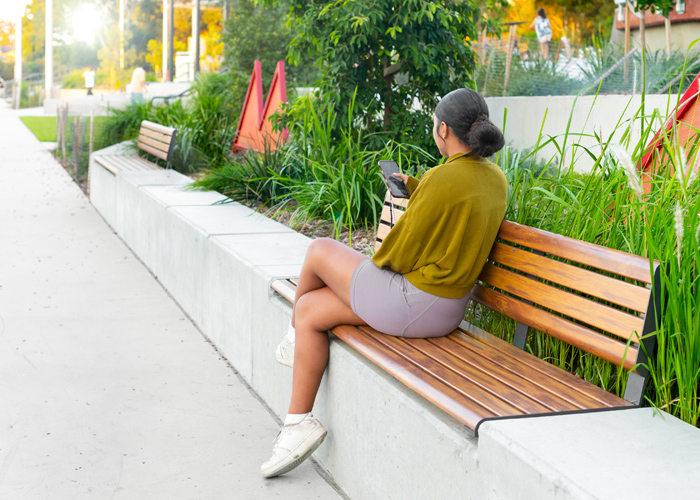 Linea Seat (LIS10, 2100mm) plinth-fixed with aluminium woodgrain Spotted Gum battens, Monument frame.