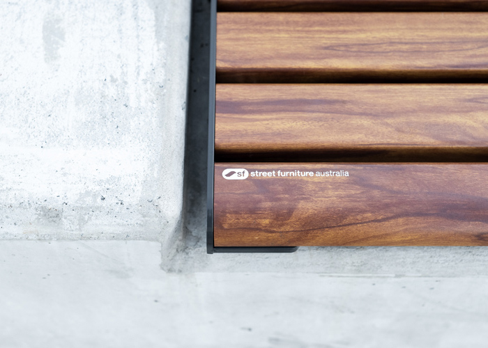 Linea Seat (LIS10) detail, plinth-fixed with aluminium woodgrain Spotted Gum battens, Monument frame.