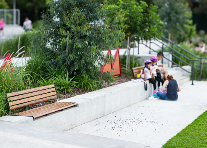 Linea Seat (LIS10, 2100mm) plinth-fixed with aluminium woodgrain Spotted Gum battens, Monument frame.