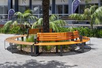 Curved Linea Seats and Benches. Frames in Textura Monument, battens in Bistro Orange and aluminium woodgrain Spotted Gum.