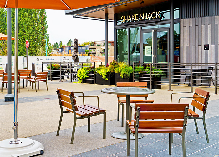 Forum Seats and Cafe Table in aluminium woodgrain Bush Cherry, and Woodland Grey.