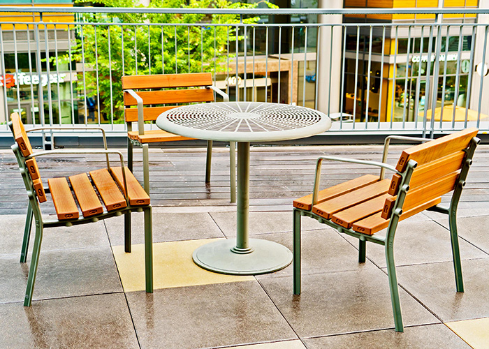 Forum Seats and Cafe Table in aluminium woodgrain Bush Cherry, and Woodland Grey.