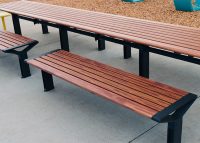Aria Long Communal Table (CMA6-L) with aluminium Spotted Gum battens, Textura Monument frames.