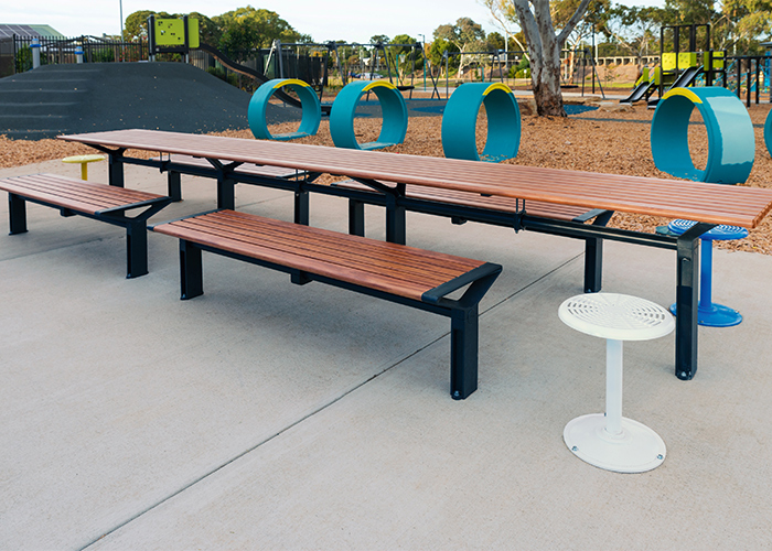 Aria Long Communal Table (CMA6-L) with aluminium Spotted Gum battens, Textura Monument frames.