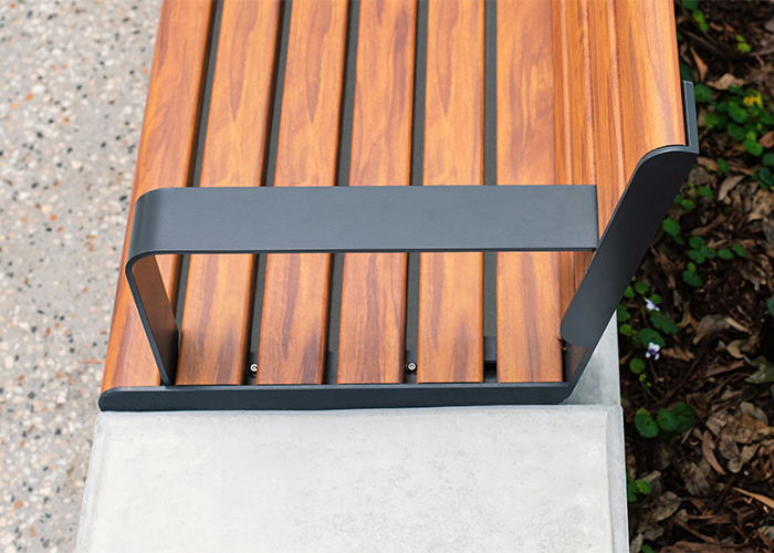 Linea Seat (LIS10) 1800mm with aluminium woodgrain Spotted Gum battens, Monument frame, plinth-fixed.