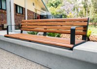 Linea Seat (LIS10) 1800mm with aluminium woodgrain Spotted Gum battens, Monument frame, plinth-fixed.