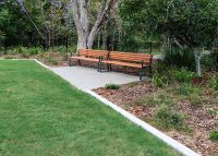 Linea Seat (LIS10) 1800mm with aluminium woodgrain Spotted Gum battens, Monument frame.