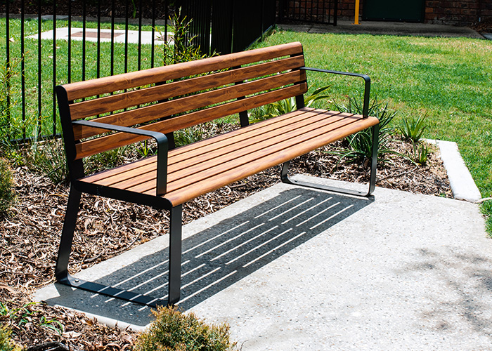 Linea Seat (LIS10) 1800mm with aluminium woodgrain Spotted Gum battens, Monument frame.