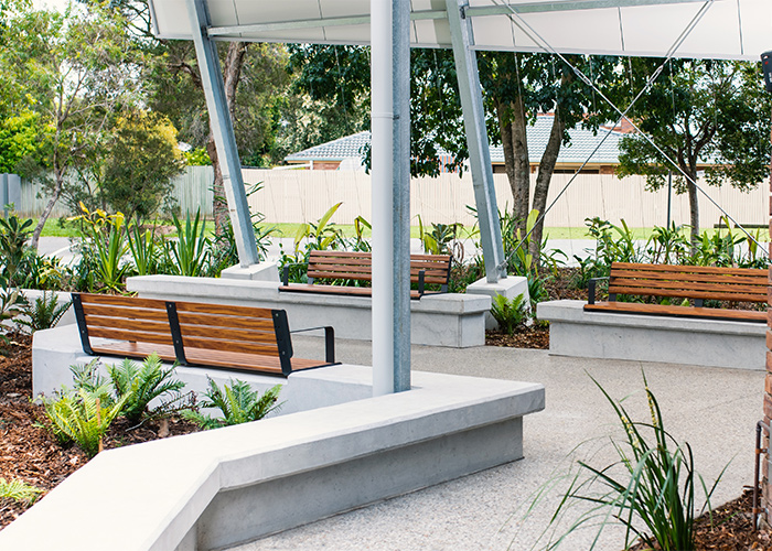 Linea Seat (LIS10) 1800mm with aluminium woodgrain Spotted Gum battens, Monument frame, plinth-fixed.