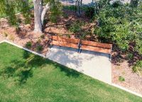 Linea Seat (LIS10) 1800mm with aluminium woodgrain Spotted Gum battens, Monument frame.