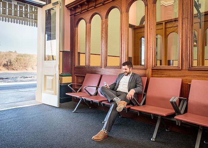 Termini's high armrests make it easy to sit and stand.