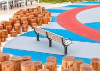 Park DDA Seat, aluminium woodgrain battens in Beach Oak, frames in Woodland Grey.