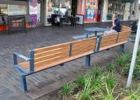 Aria Curved, Cafe Table and Stools, with aluminium woodgrain Spotted Gum battens and Deep Ocean frames.