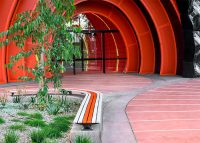 Mall Slim Bench, curved (CMM8-C) and straight (CMM8) plinth-fixed with Textura Silver and Sensation Orange battens, Charcoal frame.