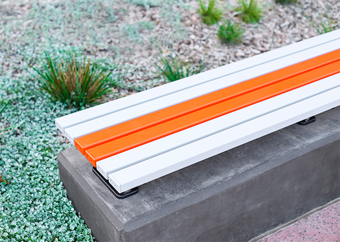 Mall Slim Bench (CMM8) plinth-fixed with Textura Silver and Sensation Orange battens, Charcoal frame.
