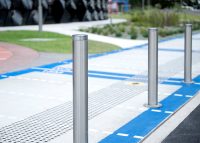 Slim Bollard (B5-F) in stainless steel 304, No.4 finish (brushed) with flat polished top.