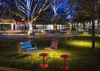 Forum Seat and Cafe Stools on the grass by Lawn Solutions. Photo: Jackie Chan, WE-EF LIGHTING.