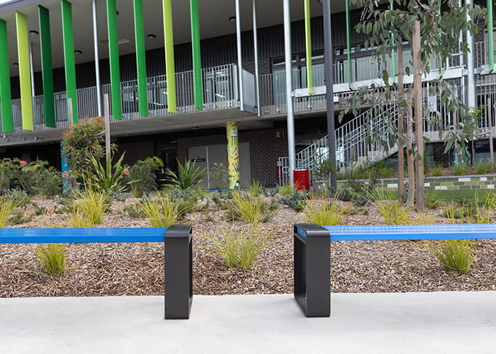 Tailored benches with powdercoated battens in Jaybird, frames in Charcoal.