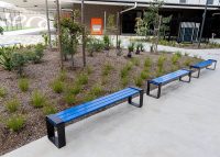 Tailored benches with powdercoated battens in Jaybird, frames in Charcoal.