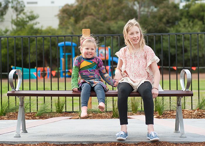 Mall Bench with eco-certified Jarrah hardwood battens and Palladium Silver frame.