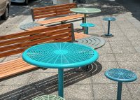 Aria Seating System (3S-C90-3B-C90-3S) with aluminium Spotted Gum battens and Textura Woodland Grey frame. Cafe Settings in tailored colour Deep Pool, Wizard and Pale Eucalypt Green.