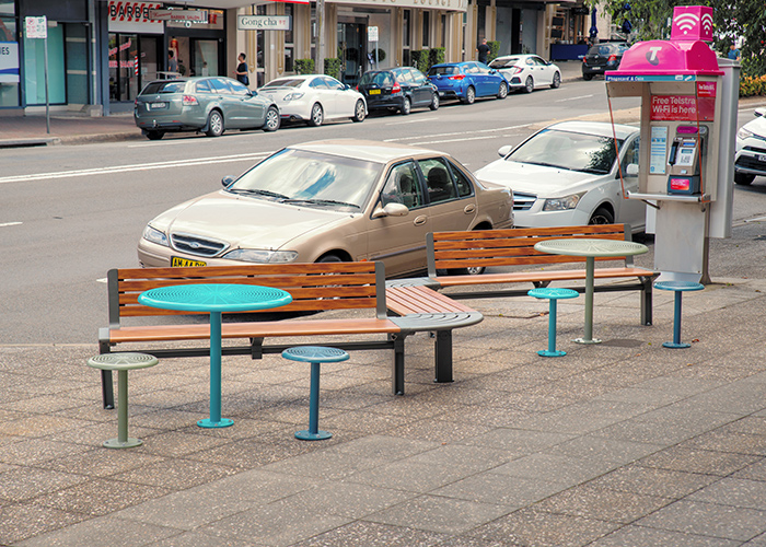 Aria Seating System (3S-C90-3B-C90-3S) with aluminium Spotted Gum battens and Textura Woodland Grey frame. Cafe Settings in tailored colour Deep Pool, Wizard and Pale Eucalypt Green.