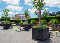 Frame Planters (PT3, Square XL) with Slots perforation in Textura Monument, height-adjustable legs.
