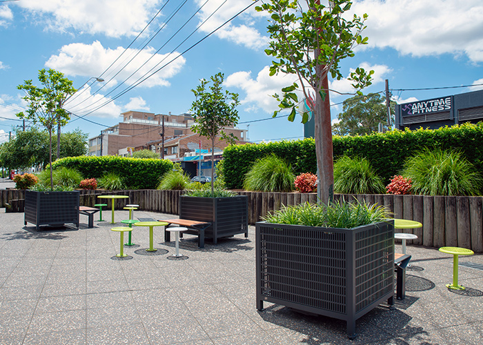 Frame Planters (PT3, Square XL) with Slots perforation in Textura Monument, height-adjustable legs.
