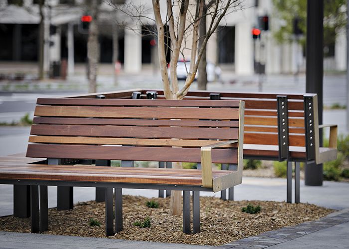 Custom seats with brass detailing. Randal Photography.