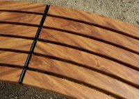 Mall Curved Slim Benches, battens in aluminium woodgrain Spotted Gum, frames in Night Sky.