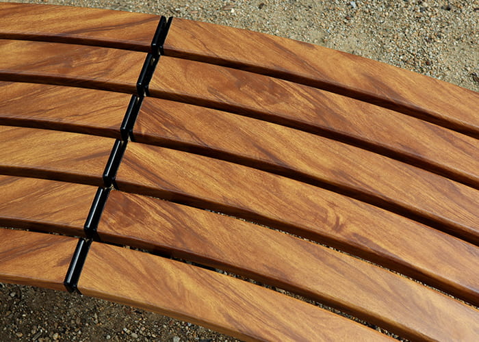 Mall Curved Slim Benches, battens in aluminium woodgrain Spotted Gum, frames in Night Sky.