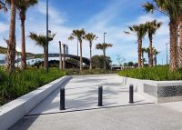 Wide Bollards protect pedestrians traversing from the carpark to amphitheatre, through green space.